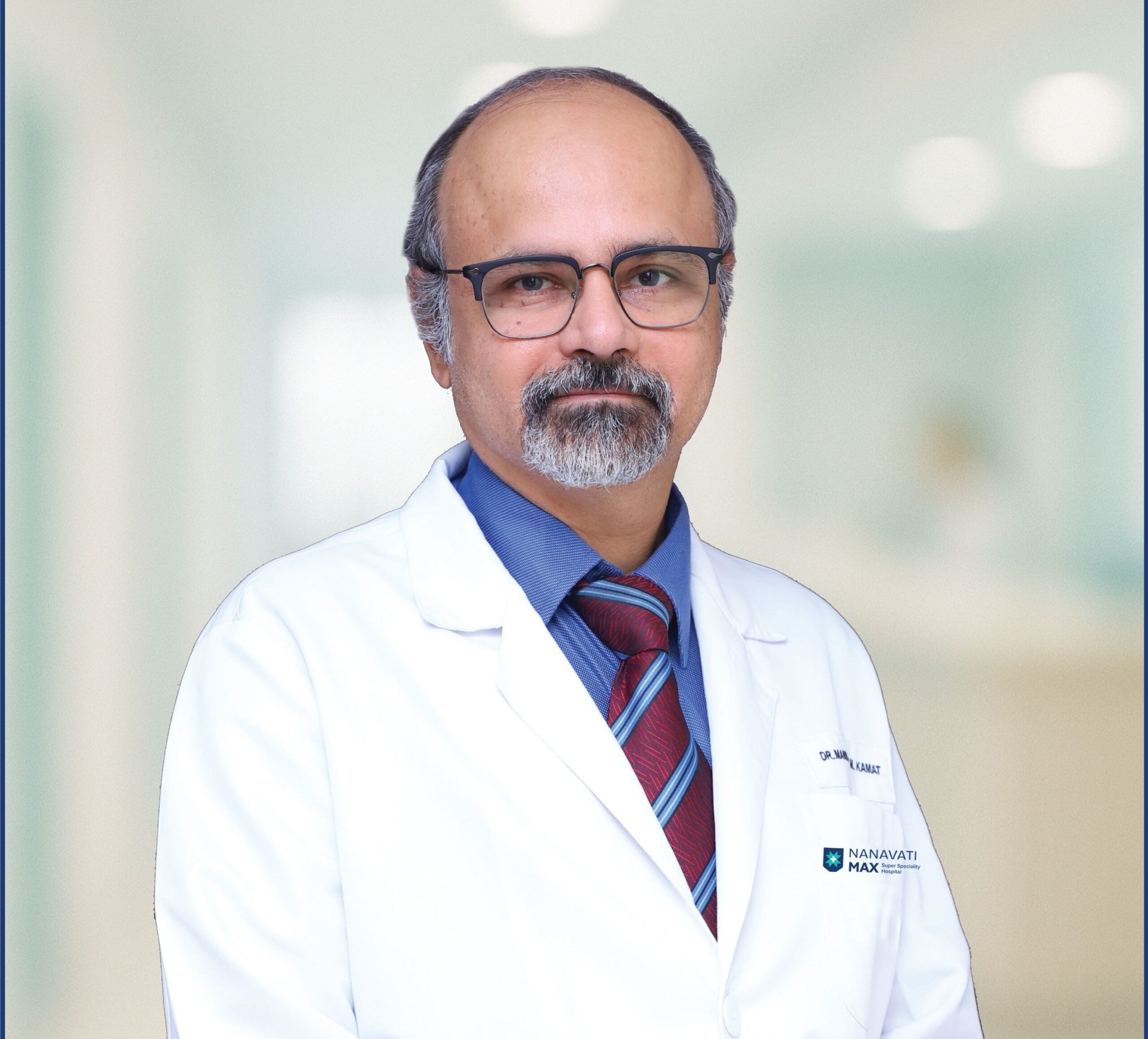 Dr. Manmohan Kamat